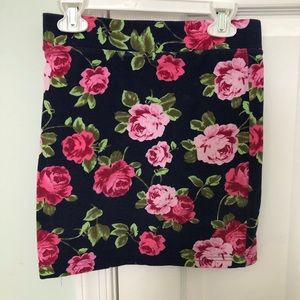 Blue skirt with flowers.